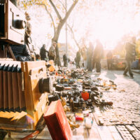 Tbilisi, Georgia - November 11, 2018: Shop Flea Market Of Antiques Old Retro Vintage Things On Dry Bridge In Tbilisi. Vintage Old Retro Large Format Camera On Ground.